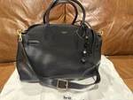 Pre-owned Coach Empire Carryall Bag 40, Brass/black. Fixed Price $530.00.